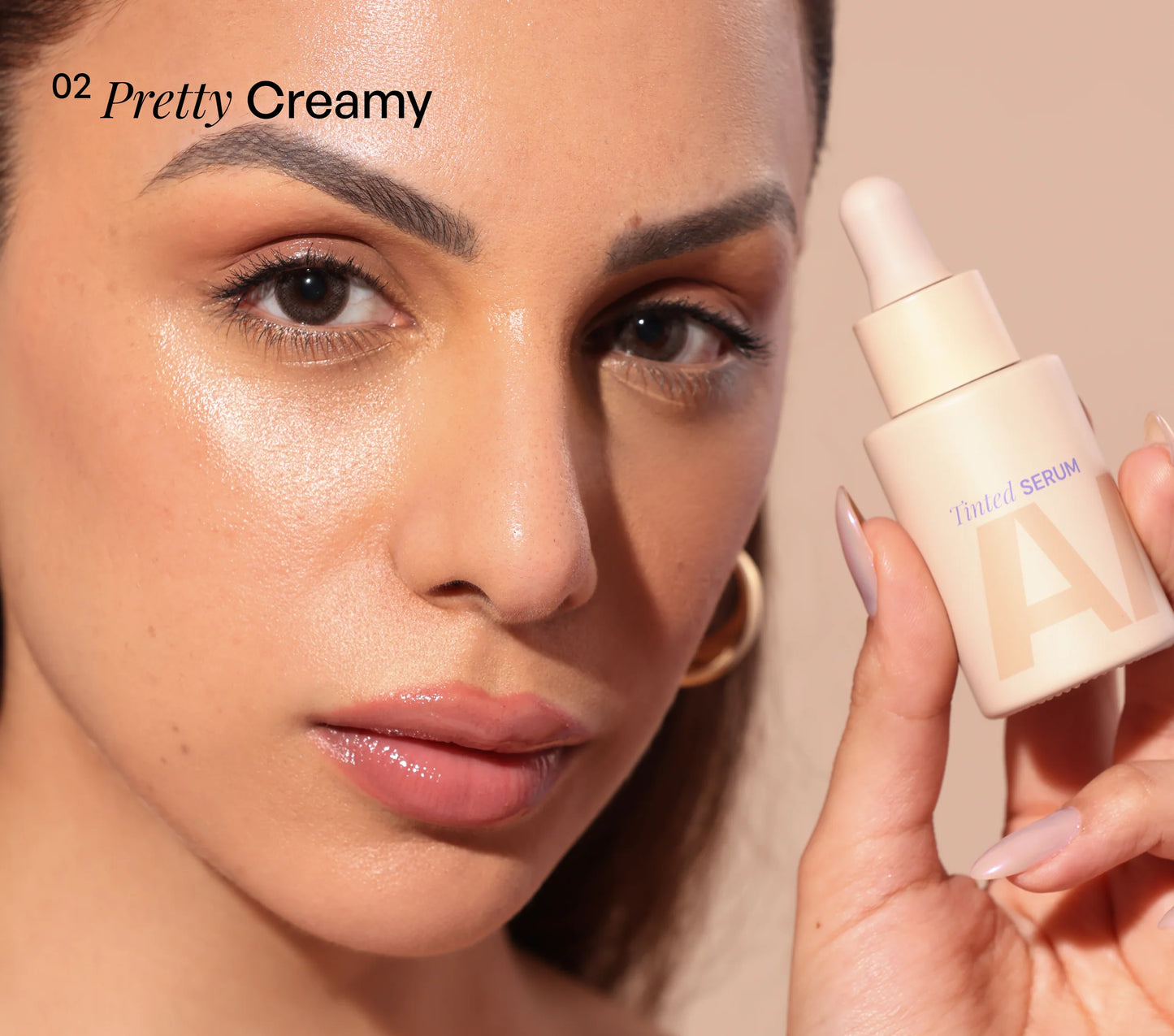 Nitibha Kaul holding ALT+K Beauty Tinted Serum in Pretty Creamy shade.